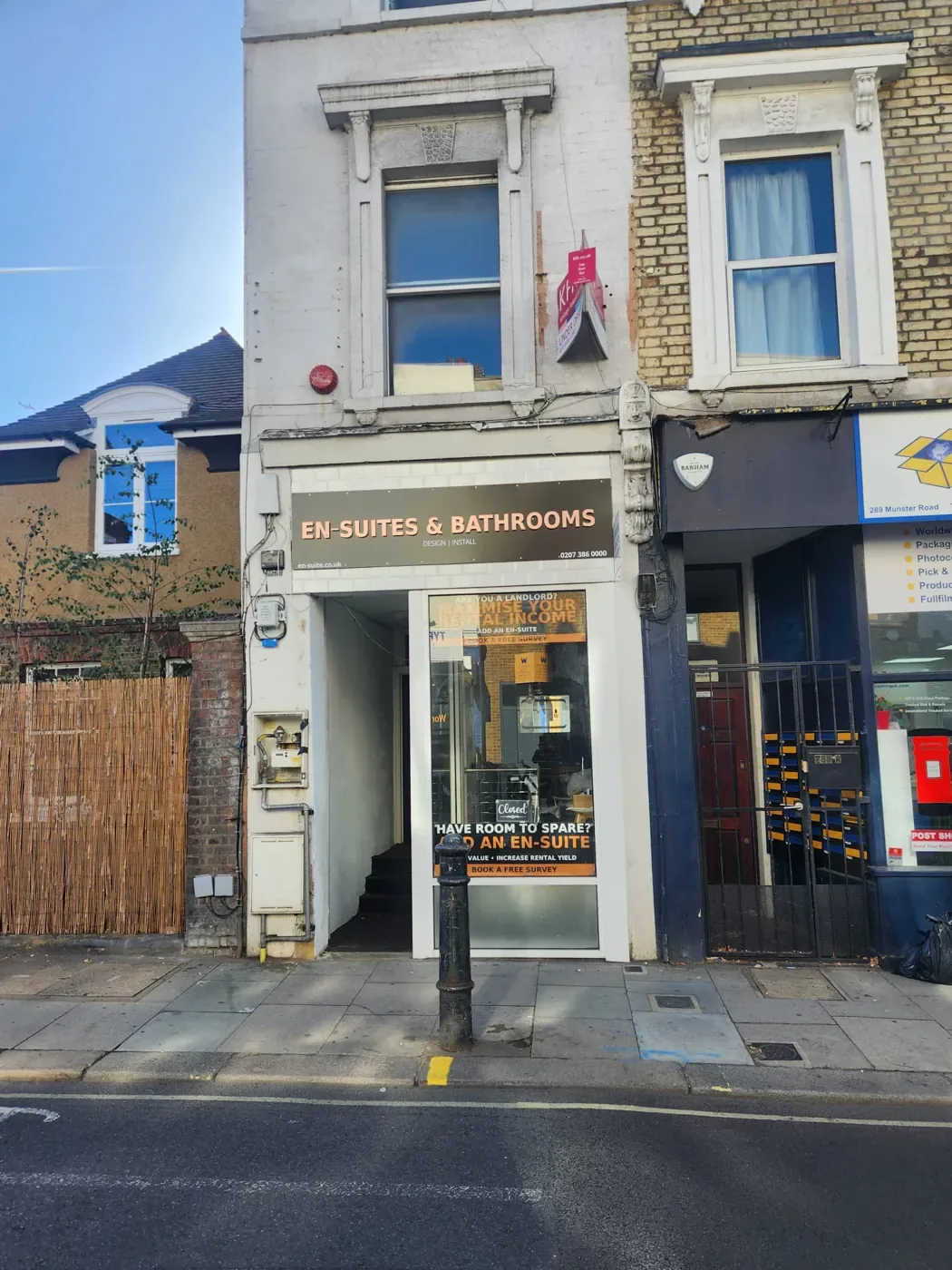 Shopfront of the En-Suites & Bathrooms shop on Munster Road, Fulham